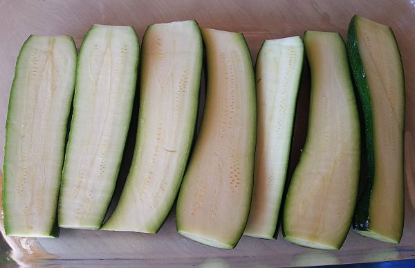 Cut courgettes in half
